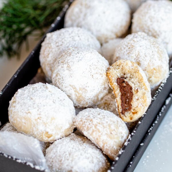 Nutella snowball cookies in a box.