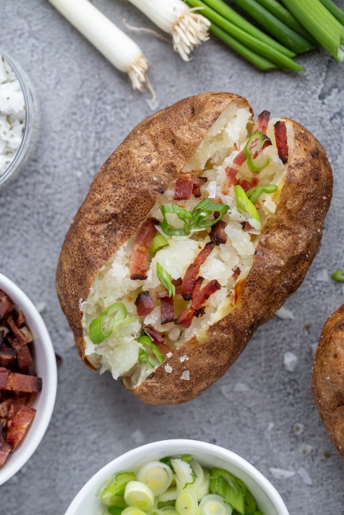 Air Fryer Baked Potato on a tray with topping