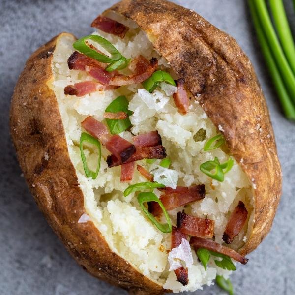 Air Fryer Baked Potato on a tray with topping