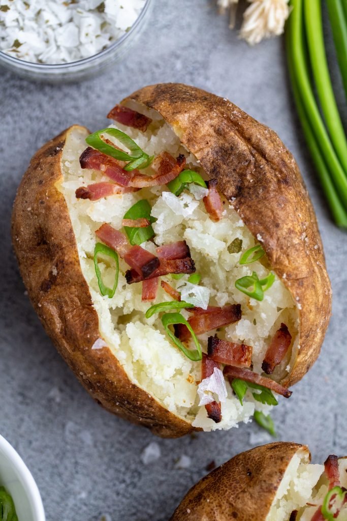 Air Fryer Baked Potato on a tray with topping