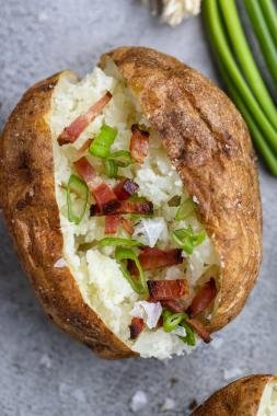 Air Fryer Baked Potato on a tray with topping