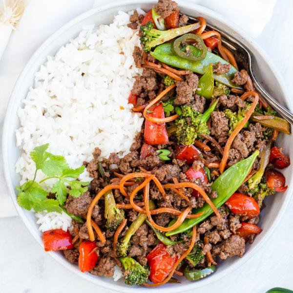 Korean Beef Stir Fry in a bowl with rice