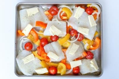 Baking sheet with fish and vegetables
