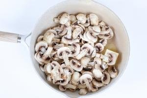 Mushrooms getting cooked in a skillet