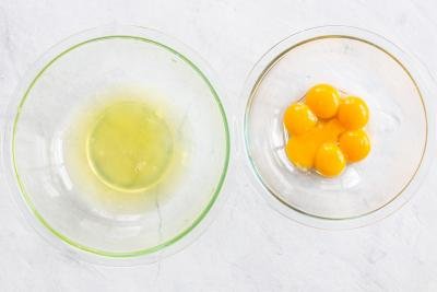 Egg whites and egg yolks in two bowl