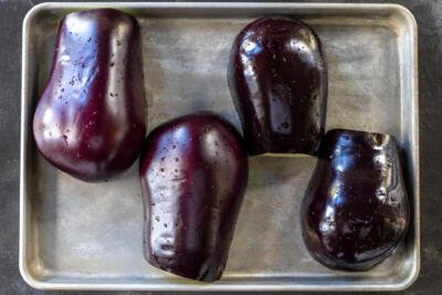 Eggplant on a baking sheet.