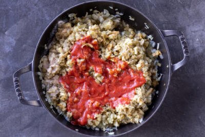 Eggplant and tomato sauce in a pan.