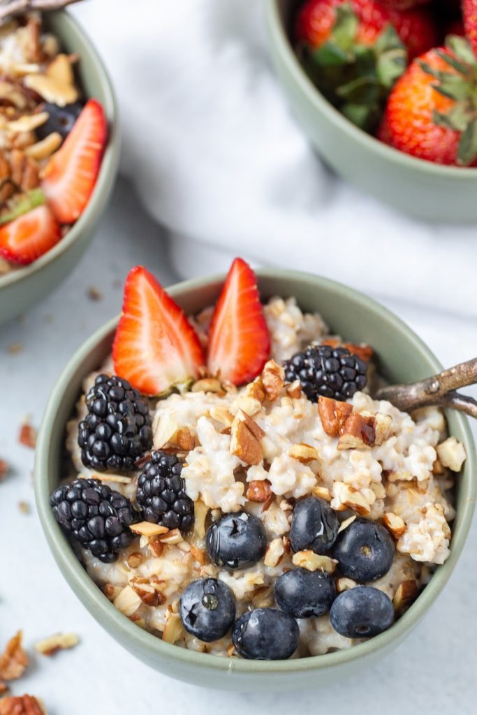 Old Fashioned Oatmeal Pudding in a bowl with fruits 