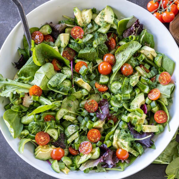 Garden Salad in a bowl with a serving bowl.