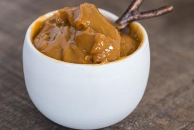 Bowl with spoon and dulce de leche in it