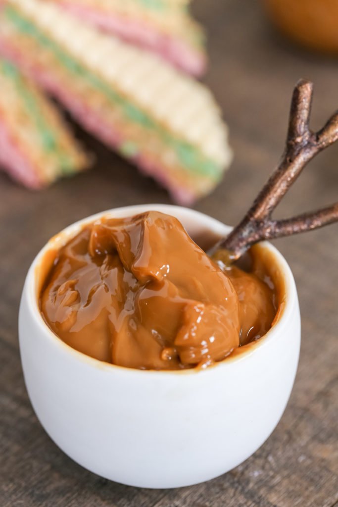 Bowl with spoon and dulce de leche in it