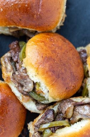 Philly Cheesesteak Sliders nexct to eahc other on the tray