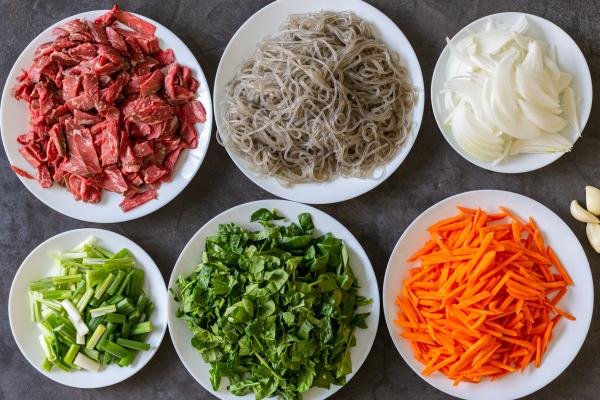 Ingredients in plates for japchae noodles