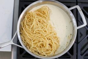 Pasta with alfredo sauce in a pan