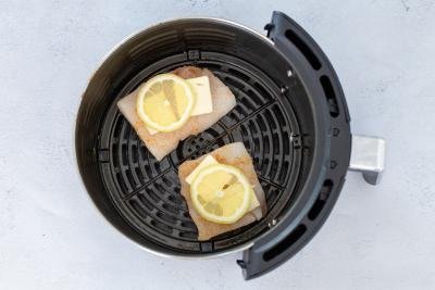Cod in airfryer basket with cod and lemon