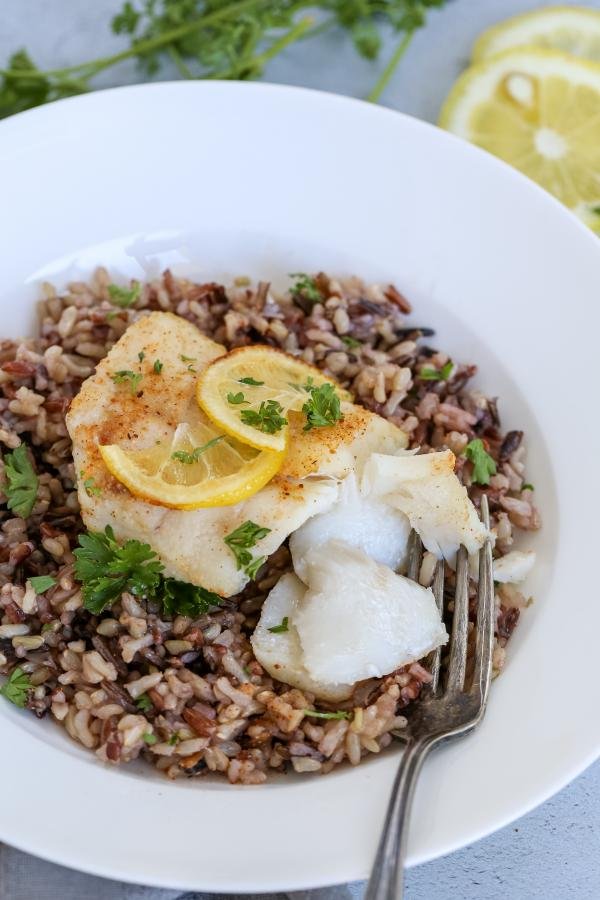 Crispy Air Fryer Cod in a plate with rice