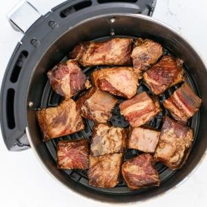 Pork ribs in an air fryer basket