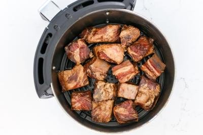 Pork ribs in an air fryer basket