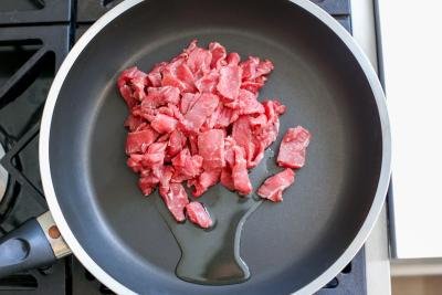 Beef cooking in a skillet