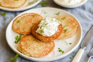 Potato Pancakes in a plate with sour-cream