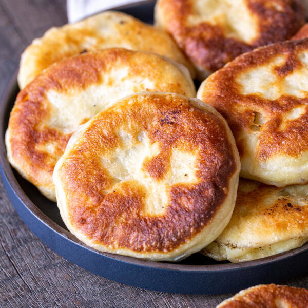 Piroshky with meat on a plate.