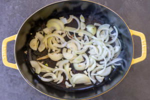 Onions cooking in a pan.