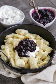 Lazy Pierogi in a bowl with jam and sour cream