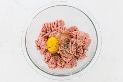 ground meat and egg in a bowl