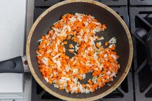 skillet with onions and carrots