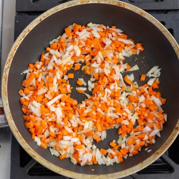 skillet with onions and carrots