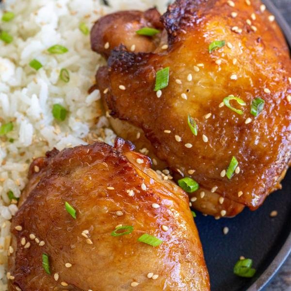 Korean Chicken Thighs in a bowl with rice