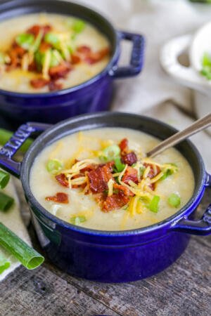 Potato soup in a serving dish with bacon.