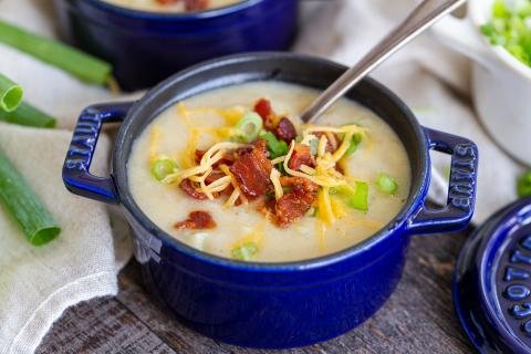 Creamy potato soup with bacon, cheese and onions