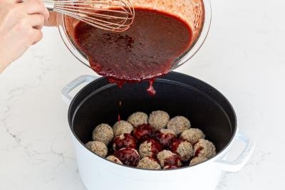 Grape Jelly sauce getting added to meatballs