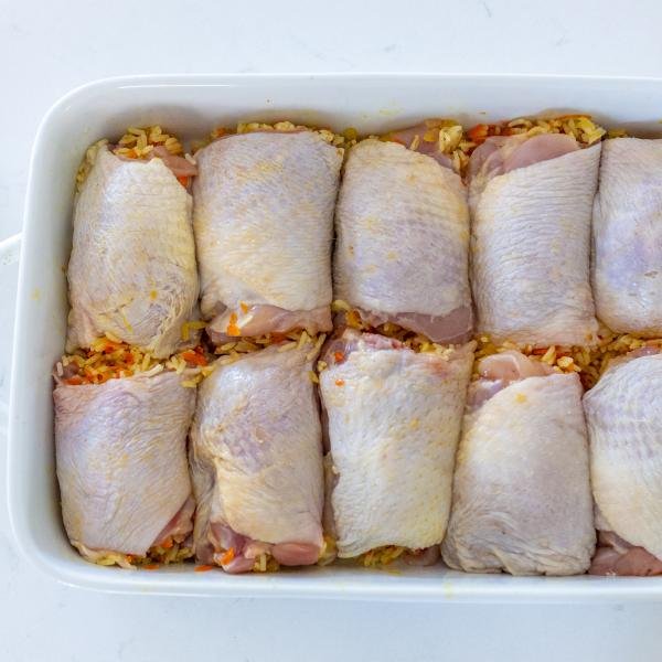 Chicken stuffed with rice in a baking dish