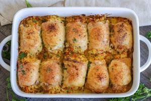 baked chicken with rice in a baking dish