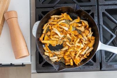 Mushrooms in a frying pan cooking