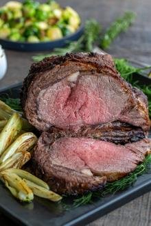 Rib Roast in a serving tray with sauce