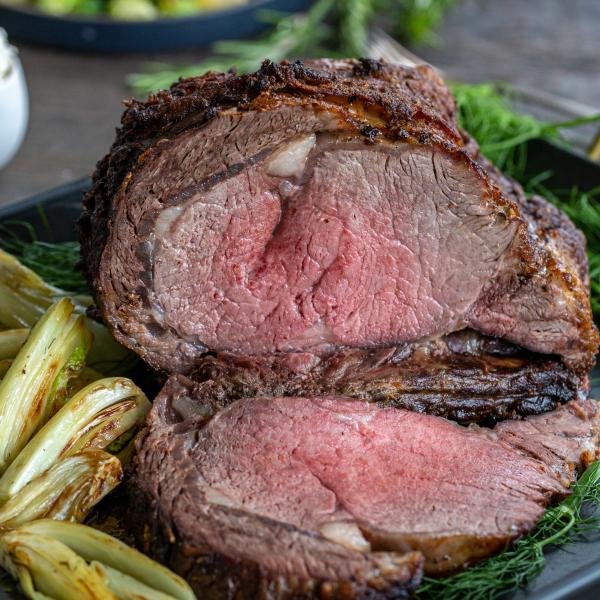 Rib Roast in a serving tray with sauce