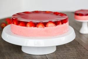 Strawberry Jello Cake on a cake stand