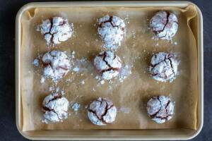 Baked Chocolate Crinkle Cookies on a baking sheet.