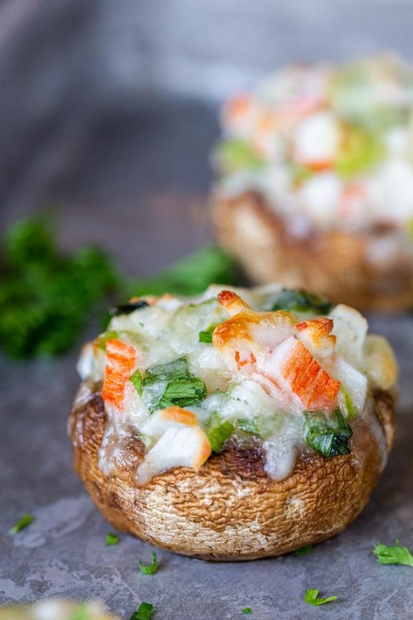 stuffed mushrooms on a baking sheet