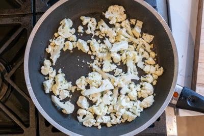 cauliflower roasting in a skillet