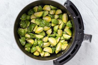 Brussels Sprouts in an air fryer basket
