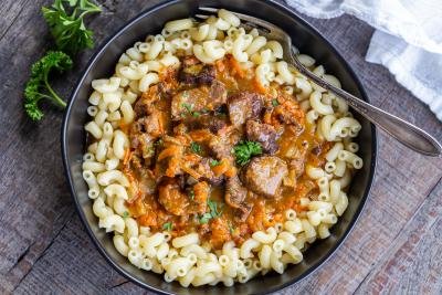 Beef gravy in a pan with noodles