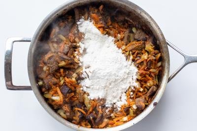 Beef with veggies and flour in a pan