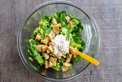 lettuce dressing and croutons in a bowl