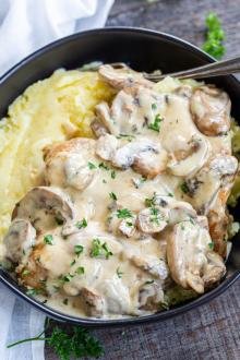 Creamy chicken and mushrooms over potatoes