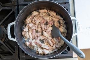 Chicken is getting cooked in a pan