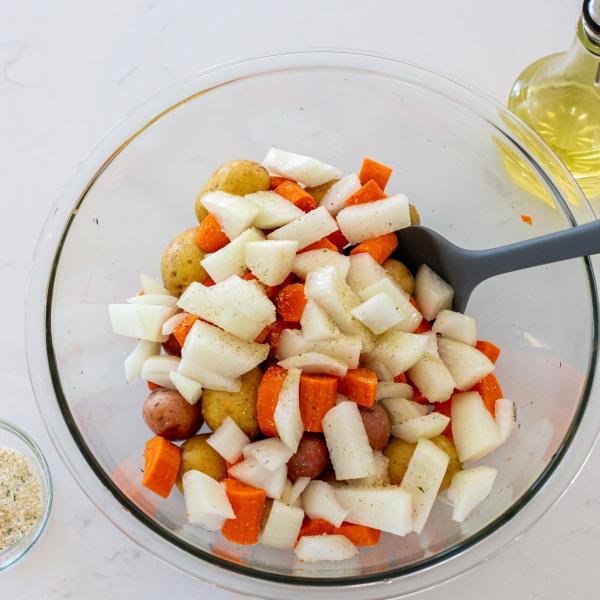 chicken with potatoes and carrots in a bowl